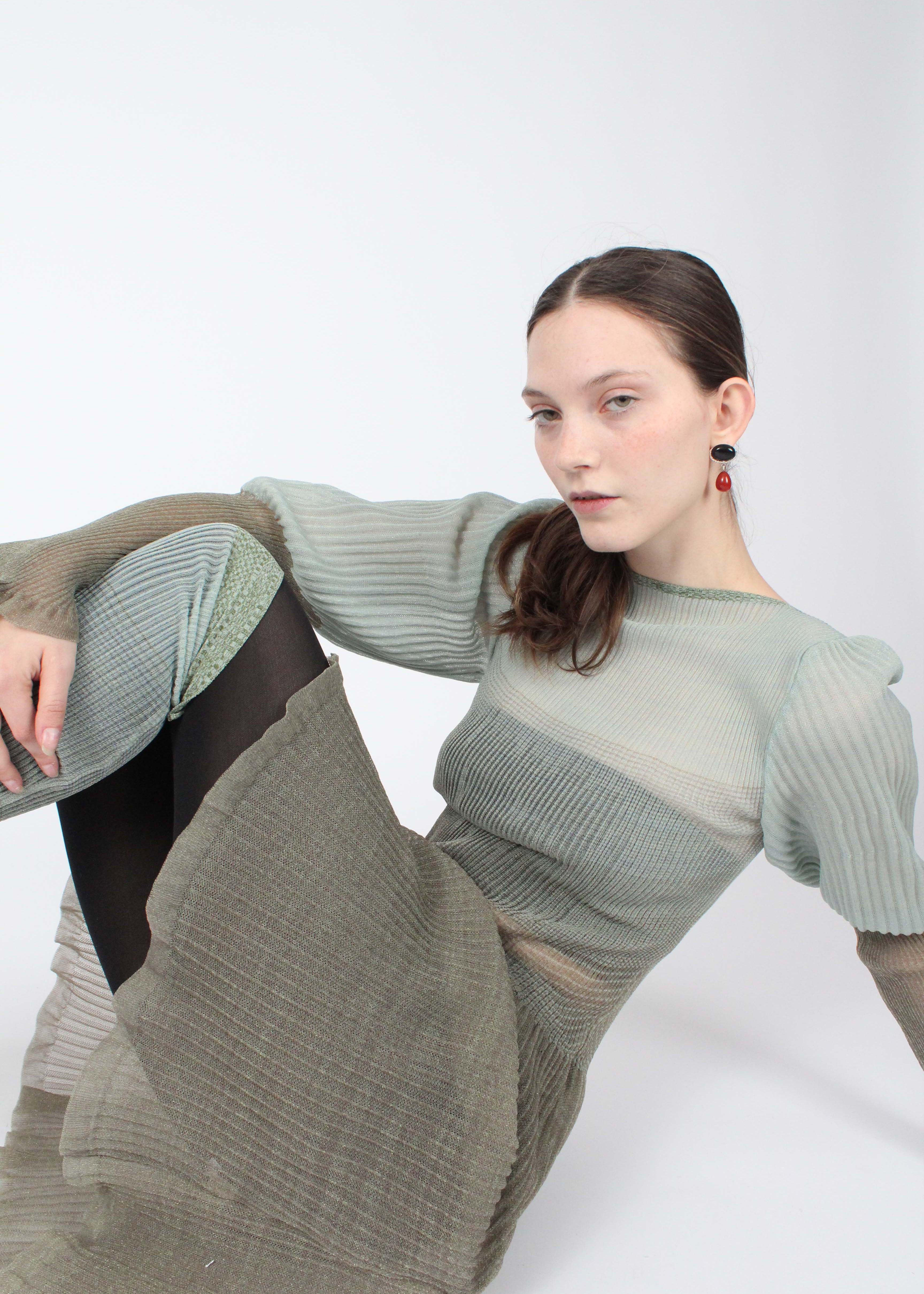 gradient knitting dress Our Gradient Intarsia Hooded Dress is crafted with the intarsia knitting technique to create the gradient splatter effect seen on several of the pieces in the S/S 26 collection. Design finished with