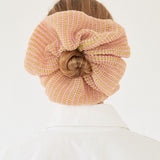 Dahlia Scrunchie in pink, knitted with glitter stripes