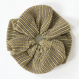 Dahlia Scrunchie in gold, knitted with glitter stripes