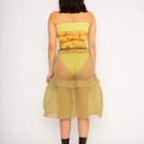 Bubble Midi Skirt in khaki is a transparent knitted trumpet skirt in a ribbed bubble texture. The skirt has a body fitted upper part and voluminous bottom. Detailed with ruffles and a melange rim with logo in the back. the textile is lightweight, delicate and very flexible, meaning the skirt adapts to body wearing it. The Bubble Midi Skirt is also available in black and comes in 2 different sizes.