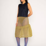 Spiral Top in navy is a knitted cropped crew neck top with spiral artwork. The textile has a shine to it and is lightweight with a smooth and soft feel against the body. The top has a slightly loose fit and is detailed with ribbed rims. The Spiral Top is available in 3 different sizes.