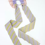 Gazania Scrunchie in peach and lilac, knitted with stripes