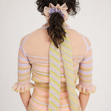 Gazania Scrunchie in peach and lilac, knitted with stripes