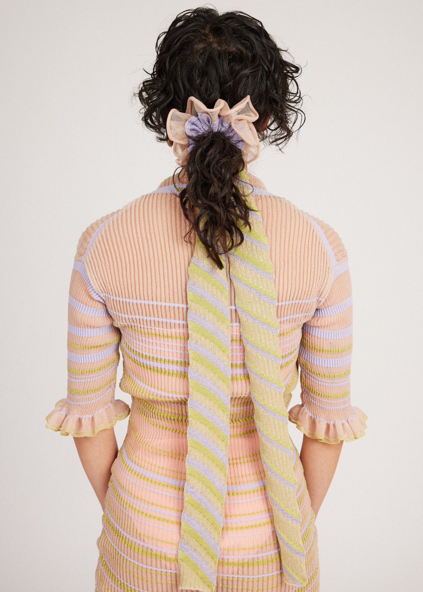 Gazania Scrunchie in peach and lilac, knitted with stripes