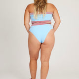 Spring Bloomer Top in light blue and red is a knitted sporty tube top with logo and ribbed edges. Knitted in a body fitted, yet flexible material that adapts to the body. Can be mixed and matched with Spring Bloomer Panty and be used as swimwear.