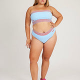 Spring Bloomer Panty in light blue and red are a knitted pair of high-waist pantys with logo and ribbed edges. Knitted in a body fitted, yet flexible material that adapts to the body. Can be mixed and matched with Spring Bloomer Top and be used as swimwear.