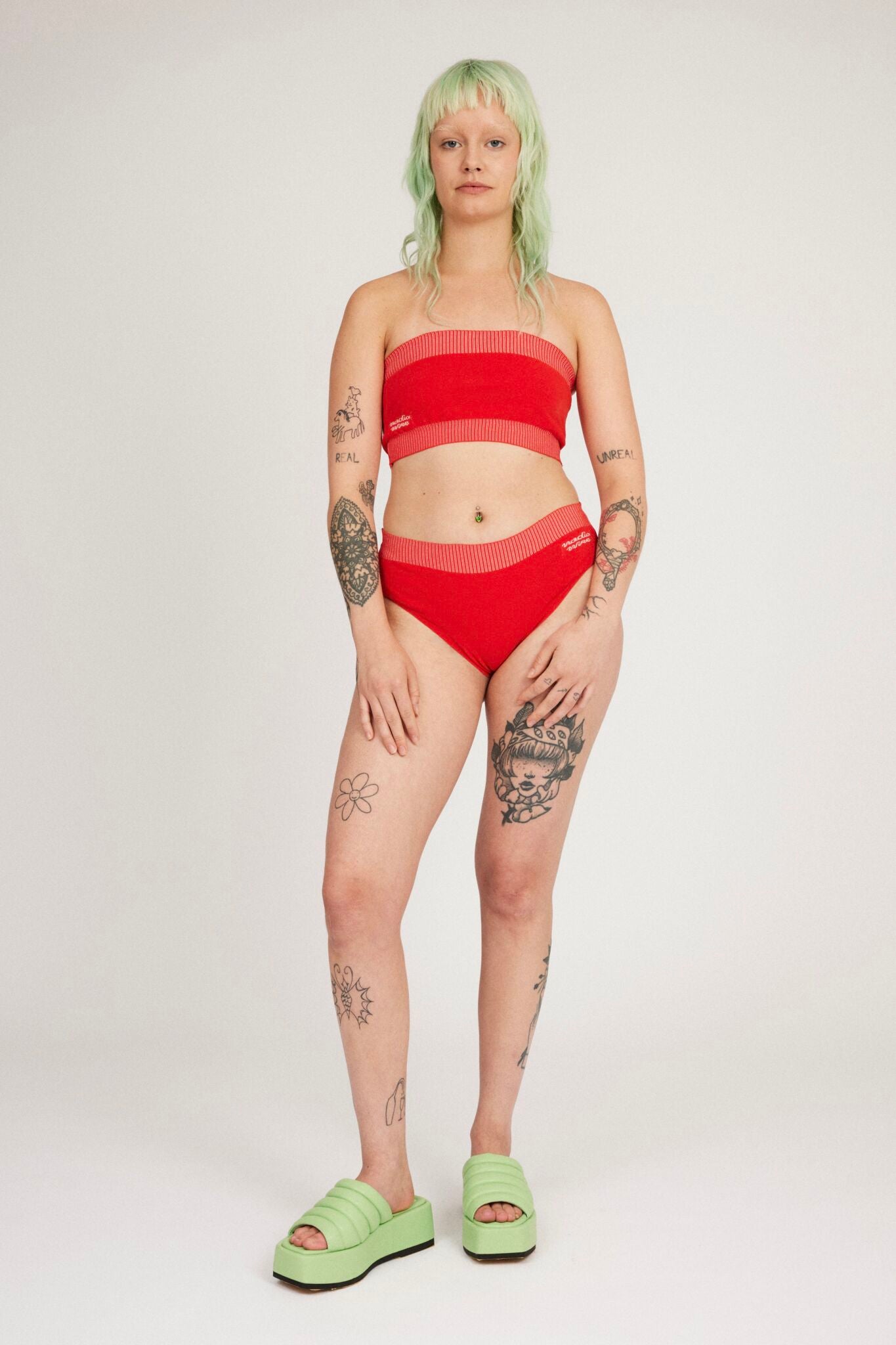 Spring Bloomer Panty in red and pink are a knitted pair of high-waist pantys with logo and ribbed edges. Knitted in a body fitted, yet flexible material that adapts to the body. Can be mixed and matched with Spring Bloomer Top and be used as swimwear.