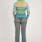 Sweet Secret Jumper in green and turquoise is a knitted transparent high neck jumper in all over bold stripes detailed with shimmery metallized yarn. The textile is lightweight, delicate and very flexible. The jumper has a body fitted silhouette that adapts to the body. Detailed with frills and a logo in the back of the neck.