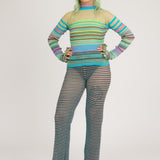 Sweet Secret Trouser in green and lavender are a knitted pair of transparent trousers in all over stripes with shimmery metallized yarn. The textile is lightweight, delicate and very flexible. The trousers have a body fitted silhouette that adapts to the body. Wide legged and detailed with frills and a logo waistband.