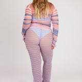 Sweet Secret Jumper in pink and powder blue is a knitted transparent high neck jumper in all over bold stripes detailed with shimmery metallized yarn. The textile is lightweight, delicate and very flexible. The jumper has a body fitted silhouette that adapts to the body. Detailed with frills and a logo in the back of the neck.