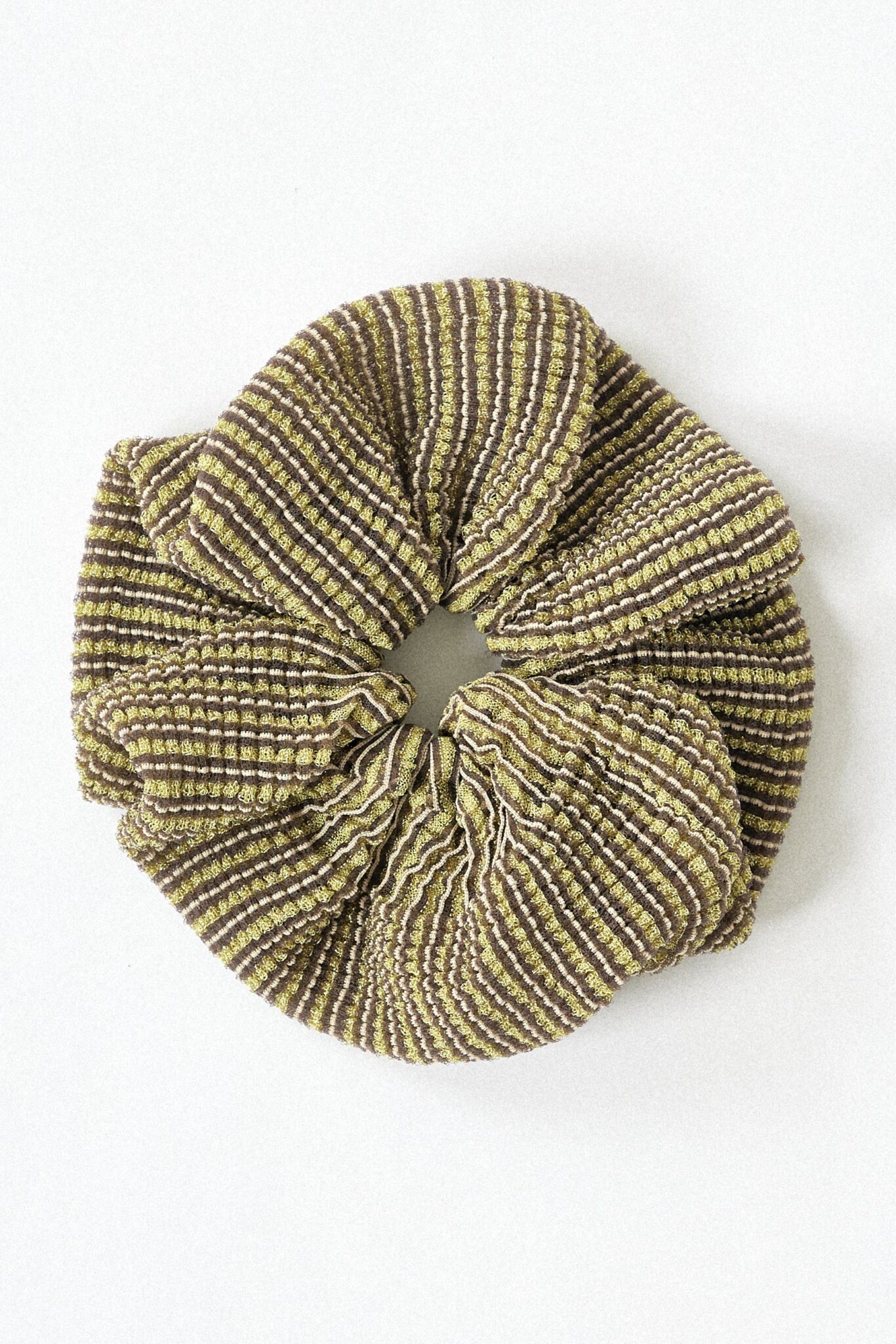 Dahlia Scrunchie in gold, knitted with glitter stripes