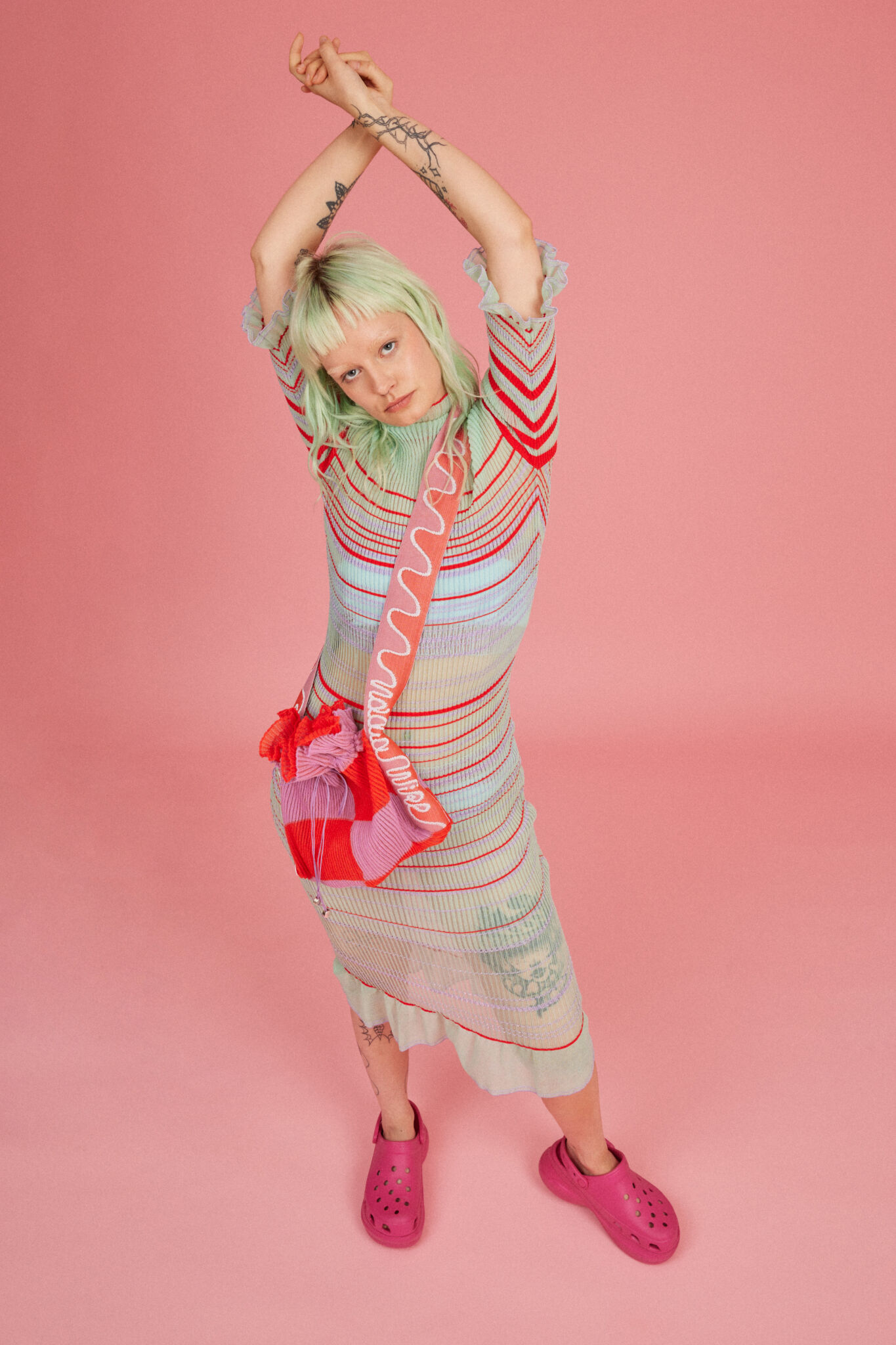 Loveable Loop shot by Amelia Lourie. Sweet Secret Dress in green. Transparent knitted striped dress. Responsibly made in Denmark.