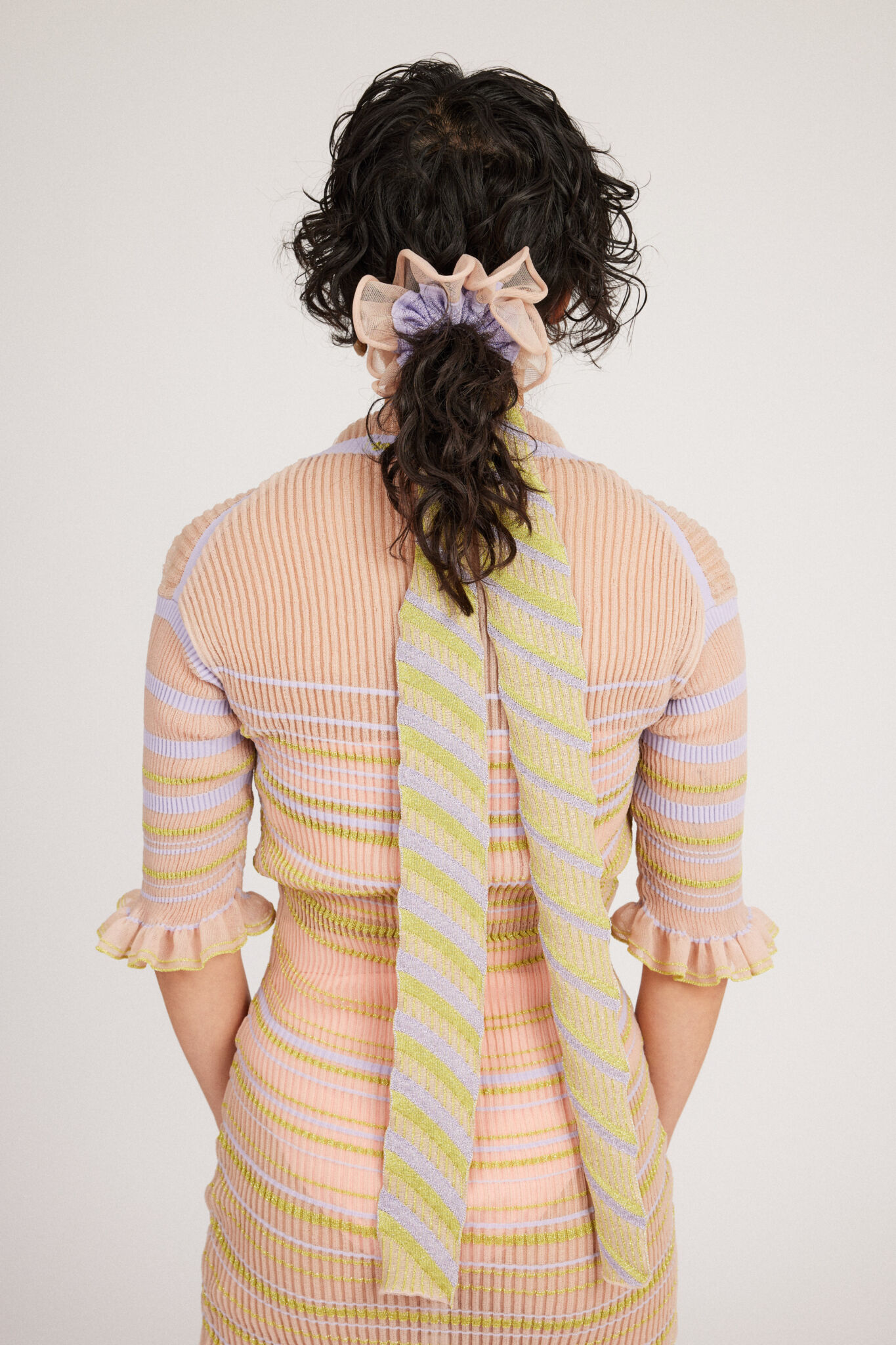 Gazania Scrunchie in peach and lilac, knitted with stripes