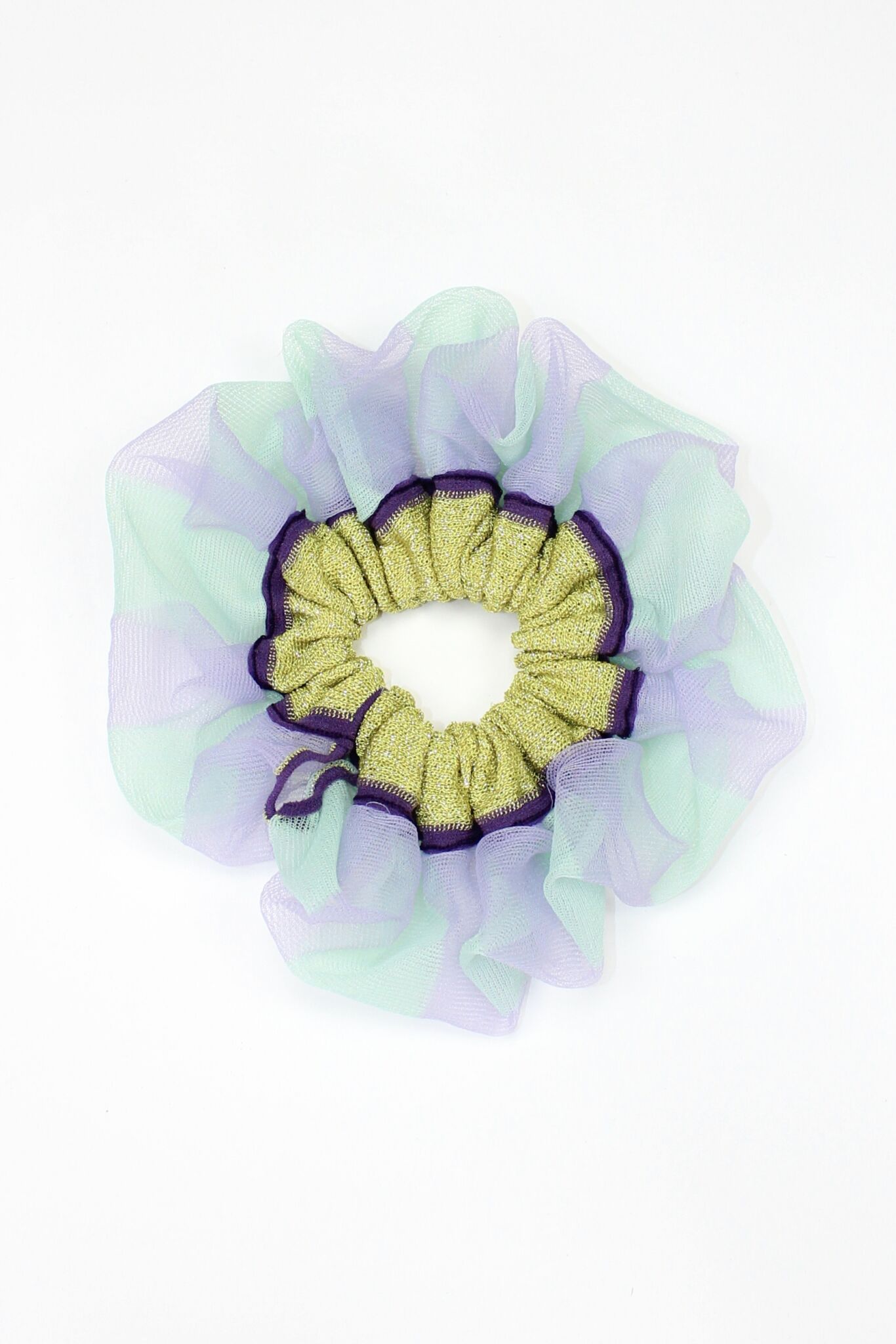 Petunia Scrunchie in mint green and lilac is a knitted scrunchie in bold stripes. Made of transparent and shimmery yarns.