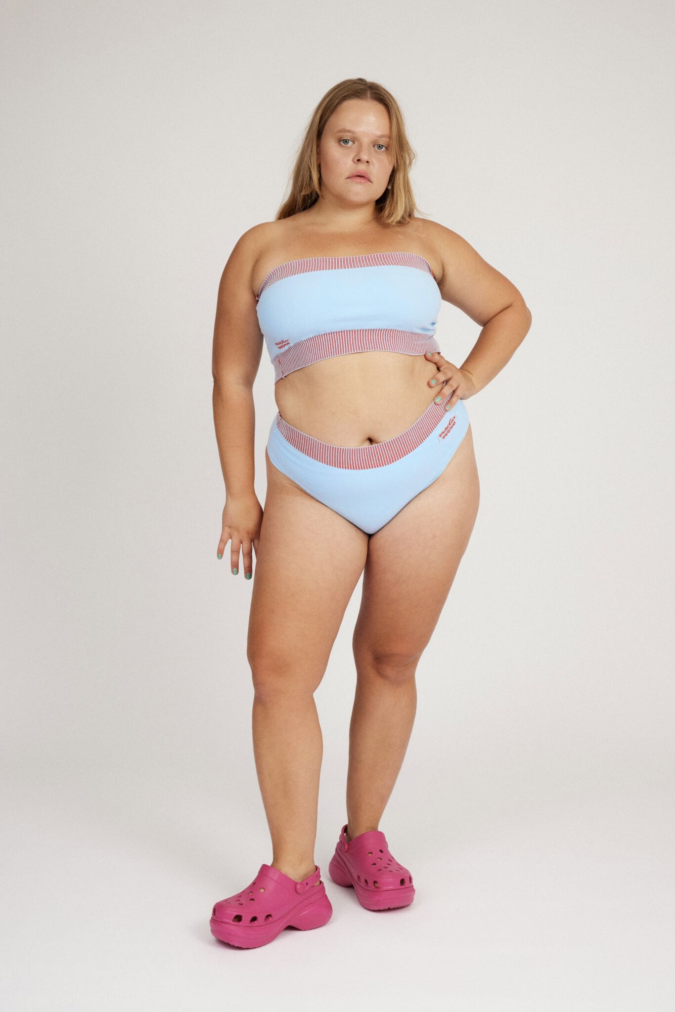 Spring Bloomer Panty in light blue and red are a knitted pair of high-waist pantys with logo and ribbed edges. Knitted in a body fitted, yet flexible material that adapts to the body. Can be mixed and matched with Spring Bloomer Top and be used as swimwear.