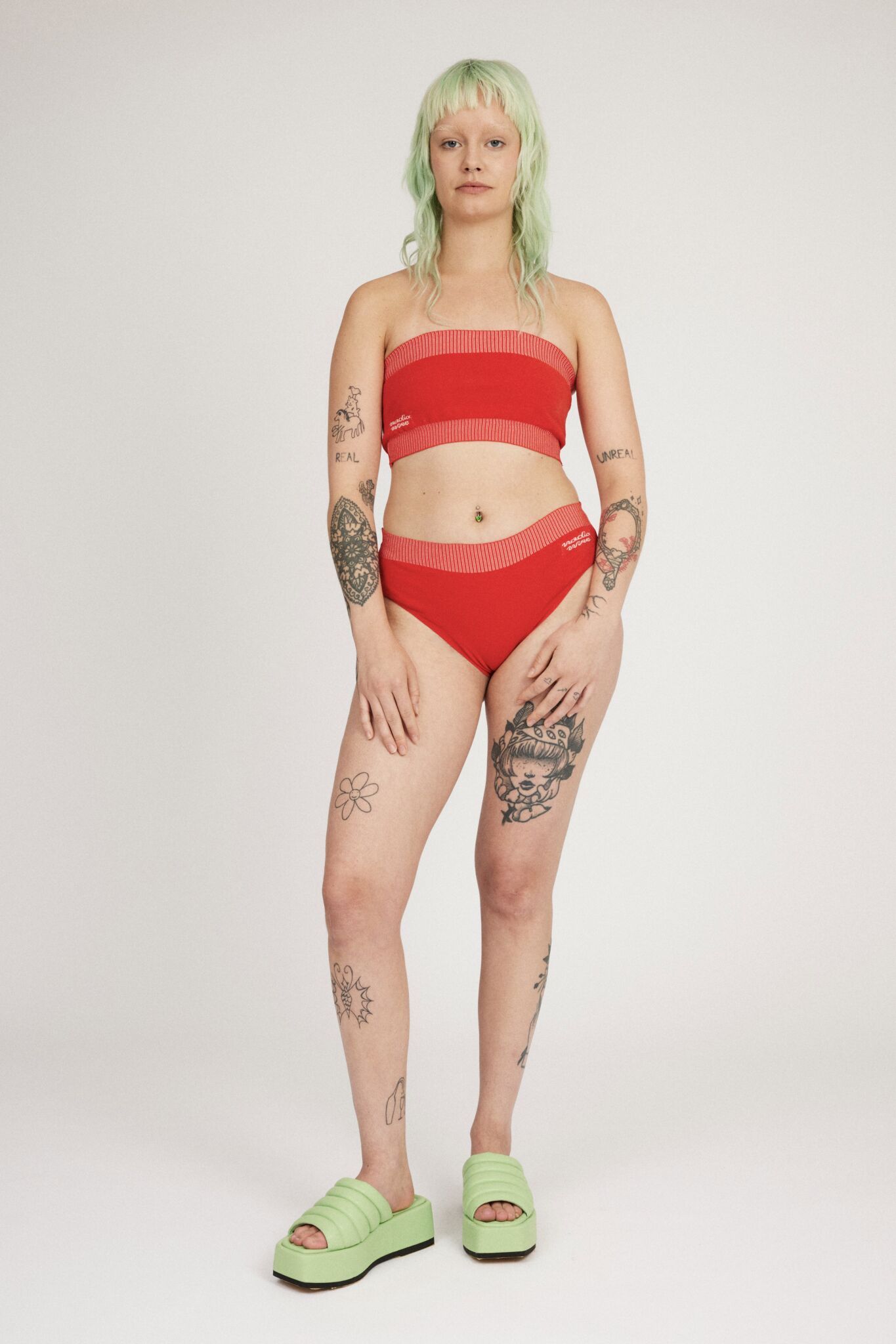 Spring Bloomer Panty in red and pink are a knitted pair of high-waist pantys with logo and ribbed edges. Knitted in a body fitted, yet flexible material that adapts to the body. Can be mixed and matched with Spring Bloomer Top and be used as swimwear.